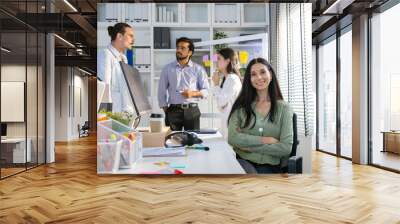 Group of multiethnic young business friends gathered in a modern office conference room and worked as a team. Wall mural