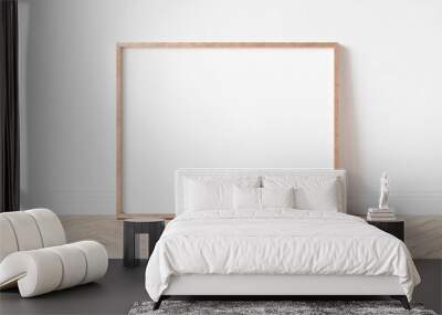 Horizontal rose gold empty frame on wooden floor. Copper frame mock up. 3D illustration. Wall mural