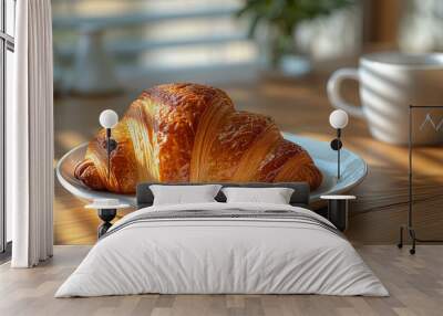 French croissant on plate on wooden table and nature sunlight with shadow through from window.  Wall mural