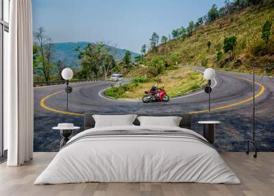 Riding a motorcycle on the road, Thailand. Wall mural