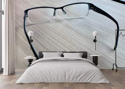 glasses on book Wall mural