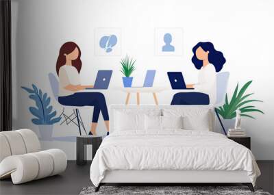 Two women working on laptops at a shared desk, surrounded by plants. Minimalistic workspace illustration representing teamwork and collaboration. Wall mural