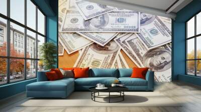 The blurry light design background of Us Dollars money on wooden desk,vintage tone Wall mural