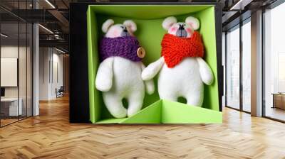 Two cute toy of white bears in a green paper box Wall mural