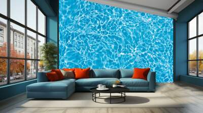 Blue water with ripples on the surface. Defocus blurred transparent blue colored clear calm water surface texture with splashes and bubbles. Water waves with shining pattern texture background. Wall mural