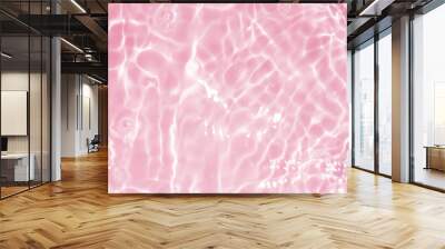 Pink water bubbles on the surface ripples. Defocus blurred transparent pink colored clear calm water surface texture with splash and bubbles. Water waves with shining pattern texture background Wall mural