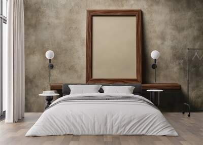 Empty wooden frame on a rustic shelf against a textured wall, perfect for displaying artwork or photographs. Wall mural