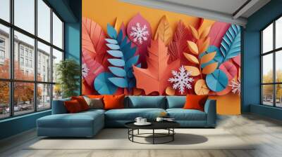 Vibrant paper leaves and snowflakes in a colorful arrangement on a bright orange background. Wall mural