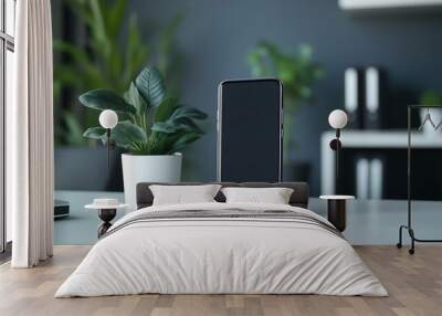 A stylish smartphone stand mockup in a contemporary design, placed on a blurred background of a tech-savvy home office Wall mural