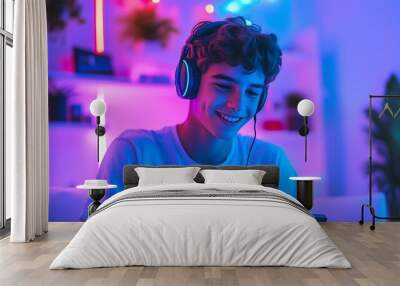 Happy gamer wear headphone competition play video game online with smartphone colorful neon light in living room at night modern house. Esport streaming game online, Home quarantine activity Wall mural