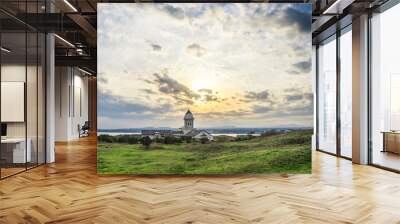 Beautiful catholic church on morning with sunrise and blue sky in Seopjikoji Mount Jeju Island , South Korea Wall mural