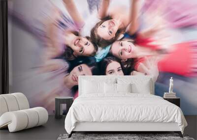 Portrait of pretty teen girls in circle. Wall mural