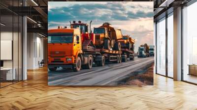 A convoy of trucks transporting various construction machines to a new site Wall mural