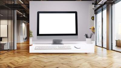 Front view of a computer with blank screen and equipment on designer or photographer workspace. Blank screen monitor for graphic display montage. Wall mural