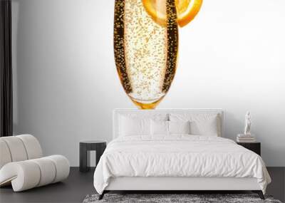 Glass of sparkling champagne with effervescent bubbles and a citrus twist. isolated on transparency background Wall mural