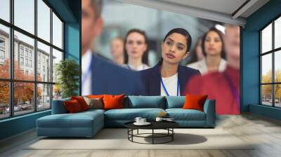 Attractive young businesswoman in a business seminar Wall mural