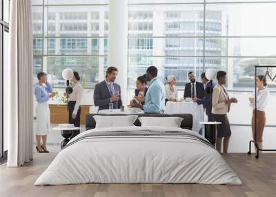 business people interacting with each other at table during a seminar Wall mural