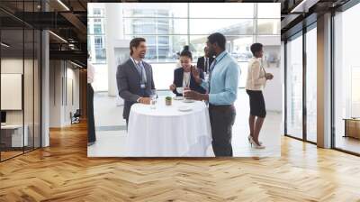 Business people interacting with each other at table during a seminar Wall mural