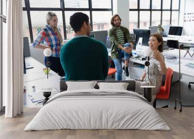 Diverse group of business people working in creative office Wall mural