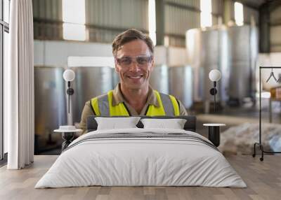 Portrait of happy technician standing with arms crossed Wall mural