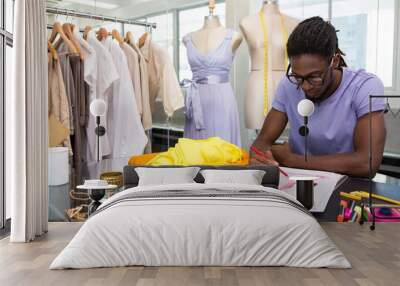 Attractive african american male fashion designer sketching Wall mural