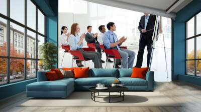 Business people applauding at the end of a conference Wall mural