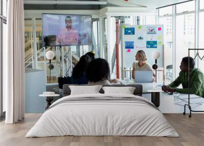 Business people attending video conference at conference room in a modern office Wall mural