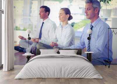 Business people doing yoga on floor  Wall mural