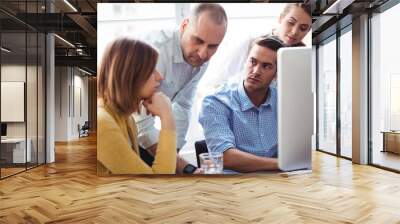 Business people looking at thoughtful coworker Wall mural