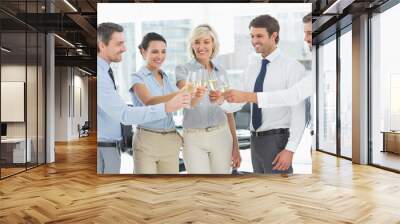 Business team toasting with champagne in office Wall mural