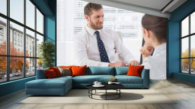 businessman meeting with a co worker at his desk Wall mural