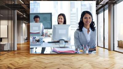 Businesswoman with a headset on in a call center Wall mural