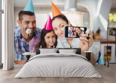 cheerful family taking selfie during birthday celebration Wall mural