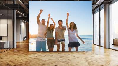 Cheerful group of friends dancing together Wall mural