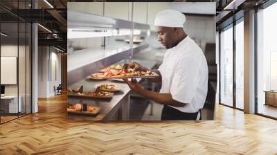 Chef garnishing dessert in commercial kitchen Wall mural