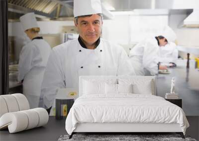 Chef holding out two salmon dishes Wall mural