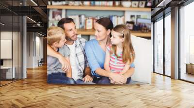 Close-up of family discussing on sofa Wall mural