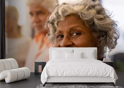 Close-up portrait of cheerful african american senior woman with multiracial friends in nursing home Wall mural