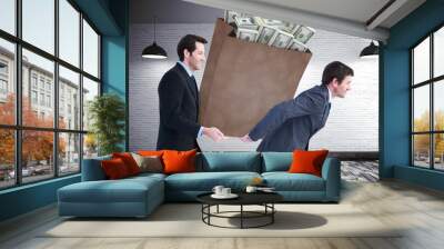 Composite image of businessmen carrying bag of dollars Wall mural