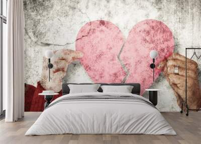 composite image of couple holding two halves of broken heart Wall mural