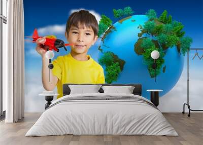 Composite image of cute boy playing with toy airplane Wall mural