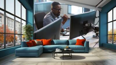 computer engineer repairing motherboard at desk Wall mural