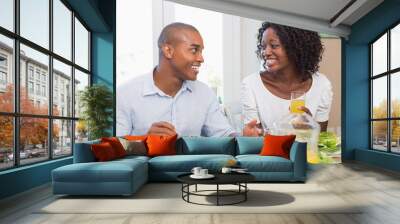 couple enjoying a healthy meal together smiling at each other Wall mural