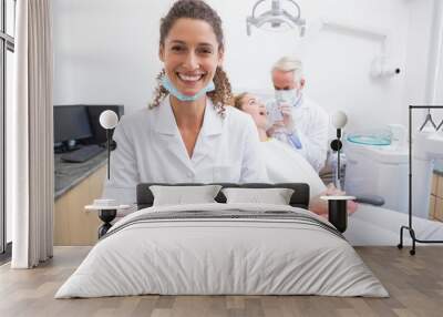 Dental assistant smiling at camera Wall mural