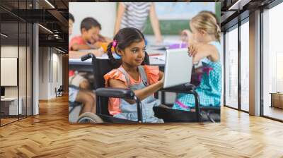 Disabled schoolgirl using digital tablet Wall mural