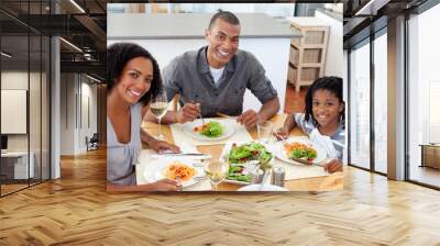 Ethnic couple dining with their son Wall mural