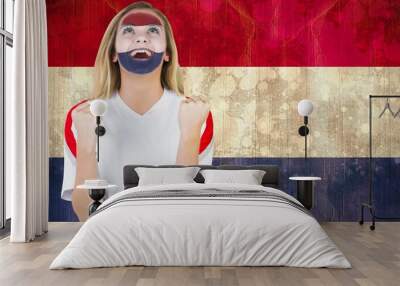 excited netherlands fan in face paint cheering Wall mural