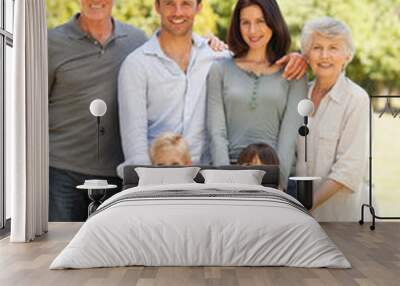 Family standing in the park Wall mural