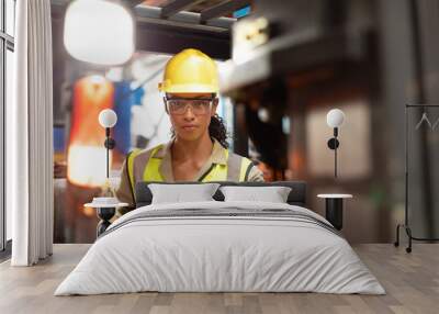 Female staff driving forklift in warehouse Wall mural