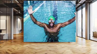 Fit man raising his arms  Wall mural